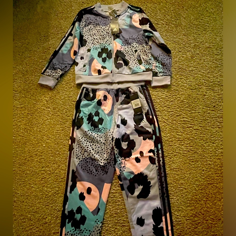 Girl adidas set New never been worn. Joggers set pink, purple black and gray.